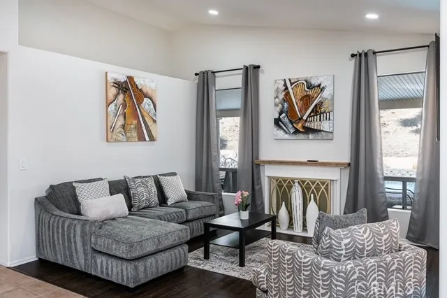a living room with furniture and a fireplace