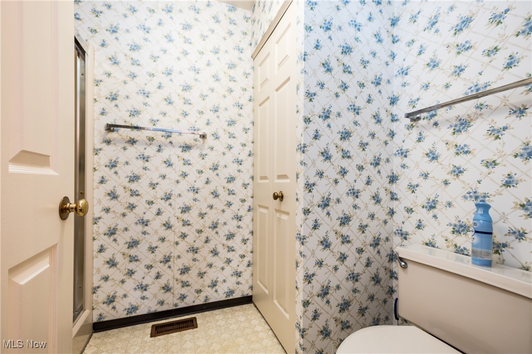 2887 Charing Cross Road Northwest Canton, OH 44708 - Photo 14 of 20 Bathroom featuring toilet, tile patterned floors, visible vents, and baseboards