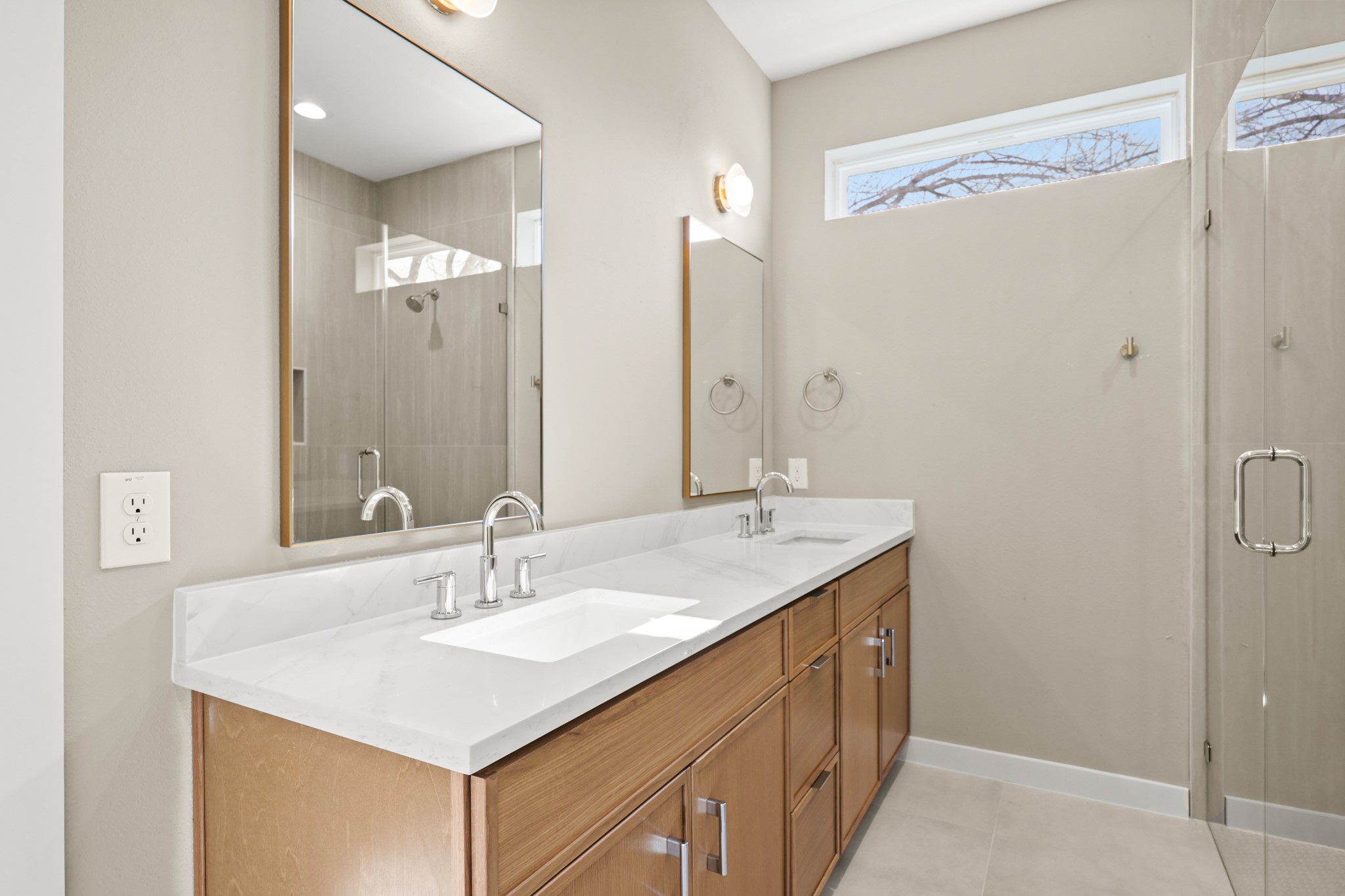 4801 Sara Drive, Unit B Austin, TX 78721 - Photo 29 of 40 a bathroom with a sink and a mirror