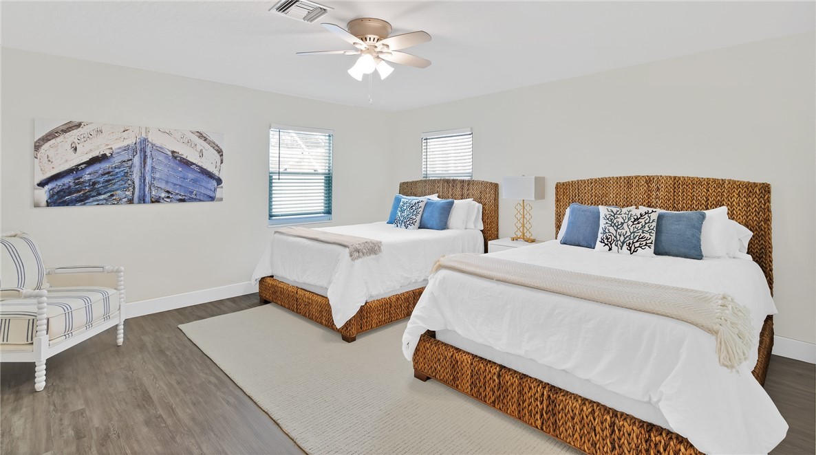 7989 143rd Street Sebastian, FL 32958 - Photo 12 of 30 a bedroom with double bed and a window