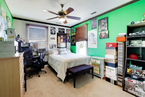 a bed room with a bed furniture and a window