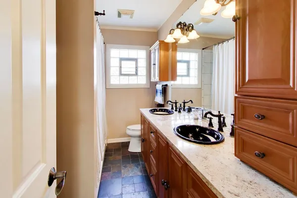 a kitchen with a sink and cabinets