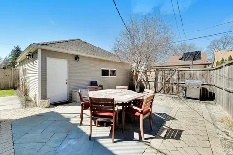 a view of a dinning tables and chairs in the patio
