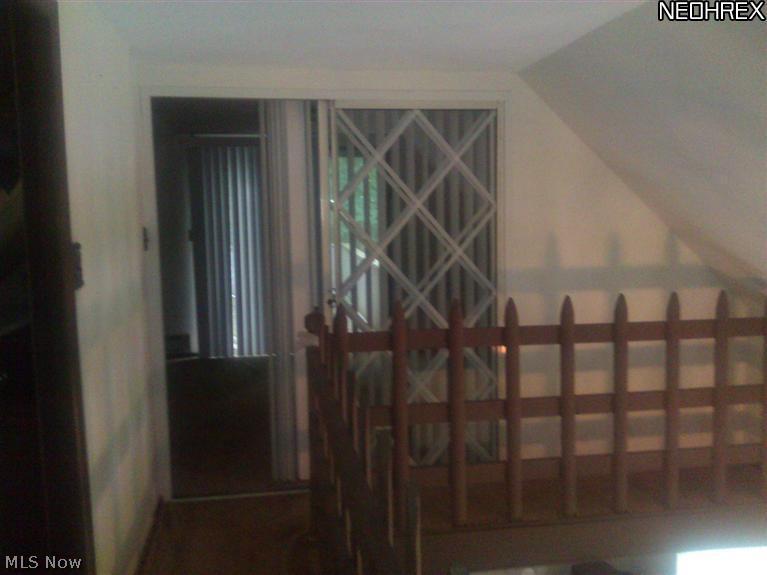 8540 Center Road Ashtabula, OH 44004 - Photo 11 of 19 Second floor hallway leading to bedroom with private terrace.
