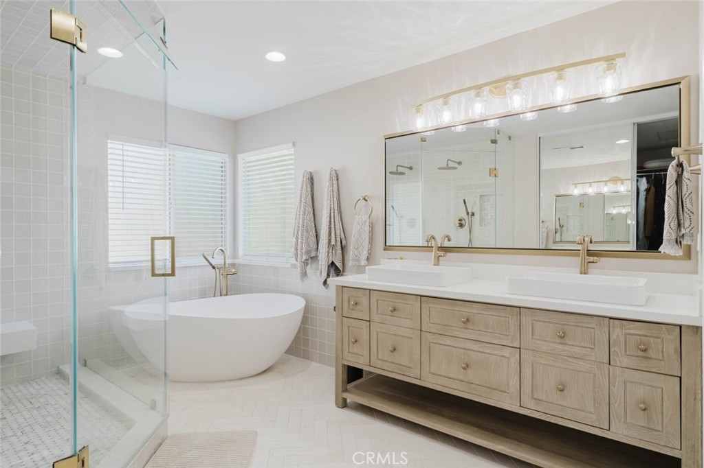 32480 The Old Road Castaic, CA 91384 - Photo 45 of 68 a spacious bathroom with a double vanity sink mirror and bathtub