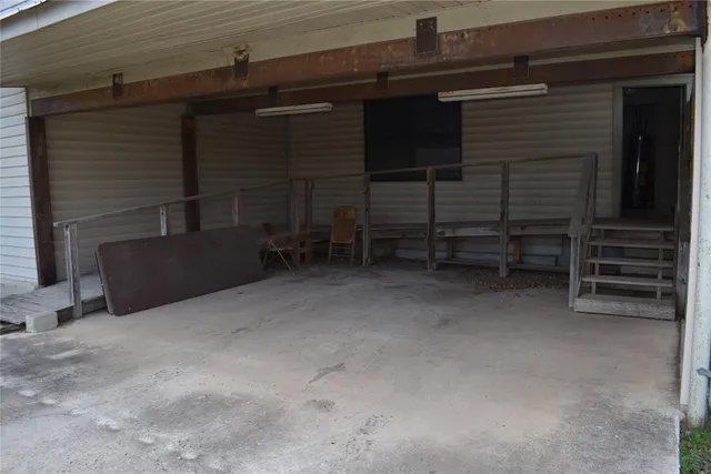 a view of an empty room with furniture and storage