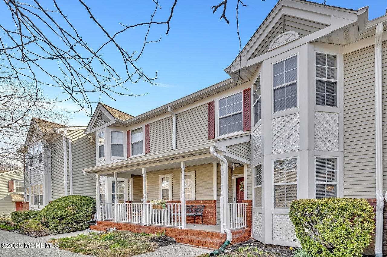 a view of a brick building next to a yard