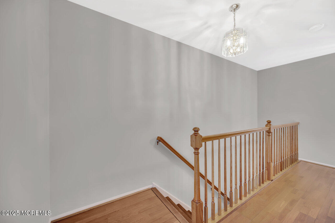 Undisclosed Address Holmdel, NJ 07733 - Photo 15 of 28 a view of a hallway with stairs