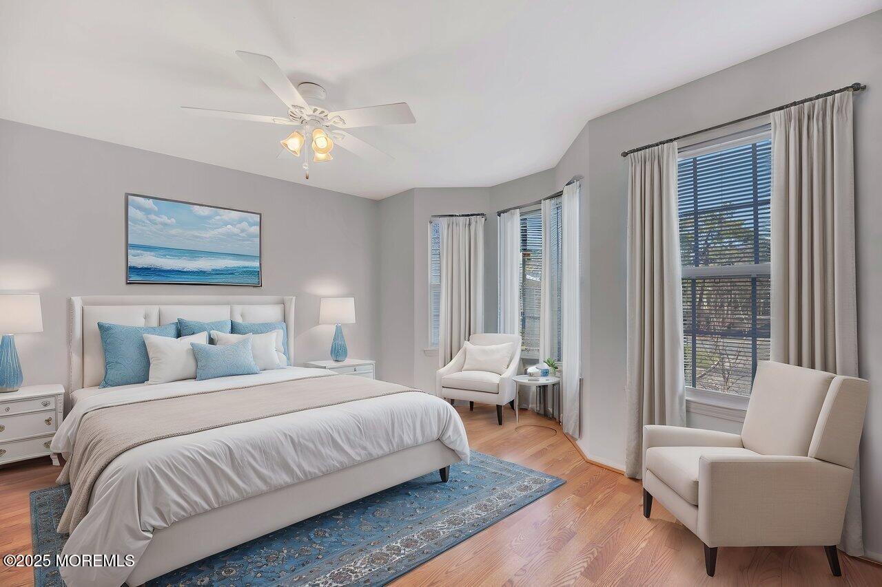 Undisclosed Address Holmdel, NJ 07733 - Photo 17 of 28 a bedroom with a bed and glass window