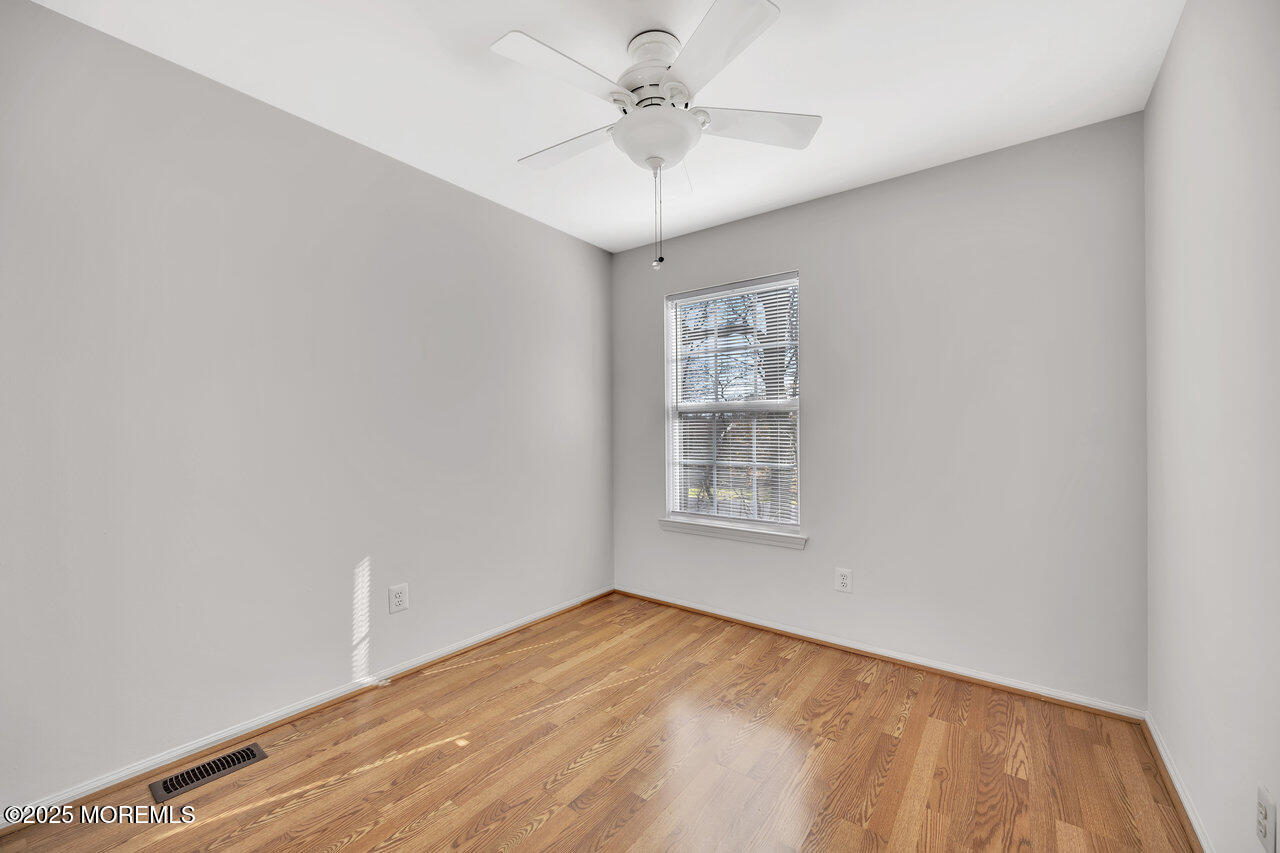 Undisclosed Address Holmdel, NJ 07733 - Photo 23 of 28 a view of an empty room with a window