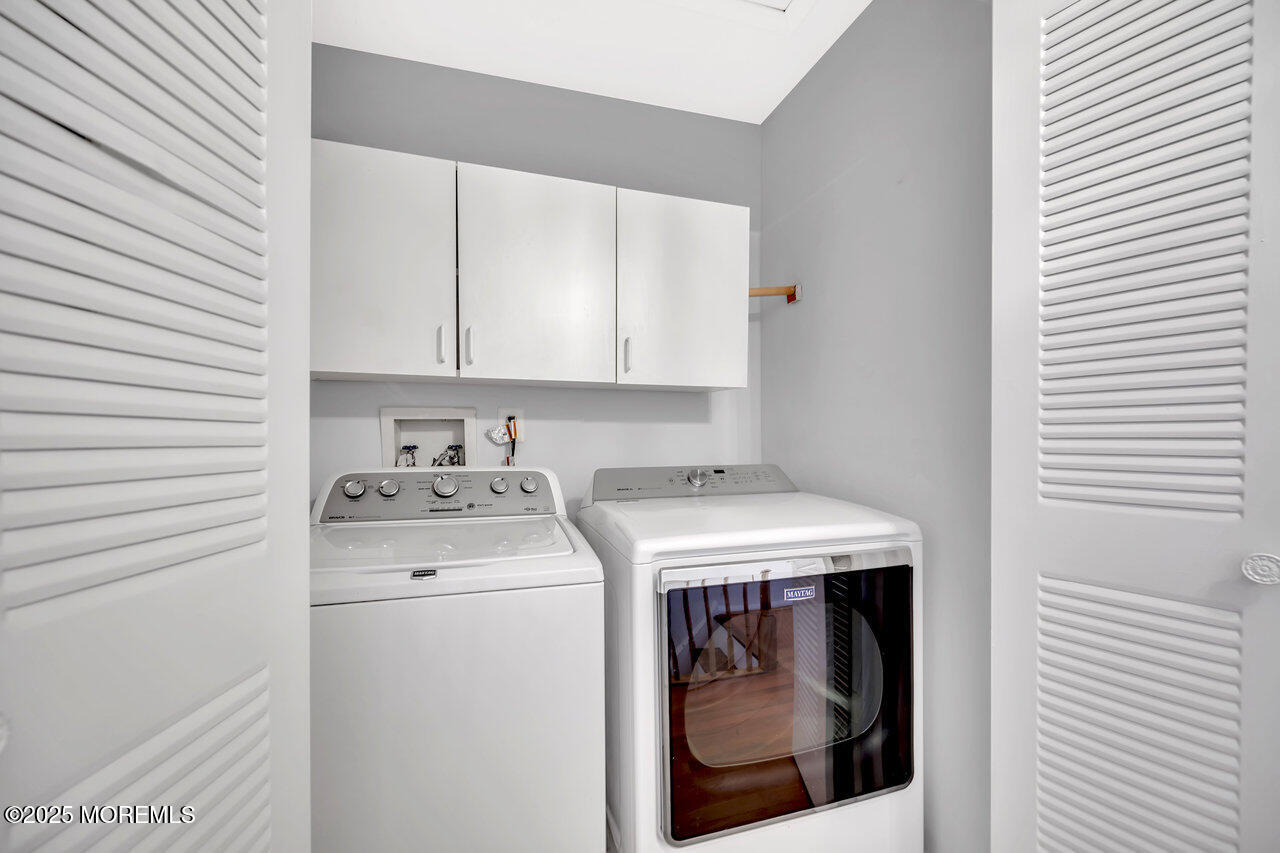 Undisclosed Address Holmdel, NJ 07733 - Photo 27 of 28 a utility room with dryer and washer