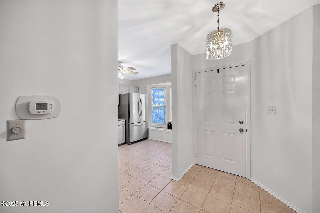 Undisclosed Address Holmdel, NJ 07733 - Photo 5 of 28 a view of a hallway view with chandelier