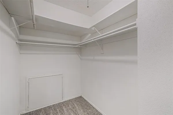 a view of storage and utility room with empty racks