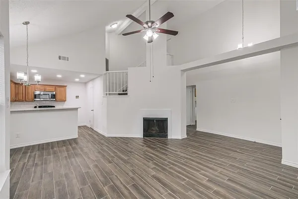 a view of a kitchen with a sink and a kitchen counter top