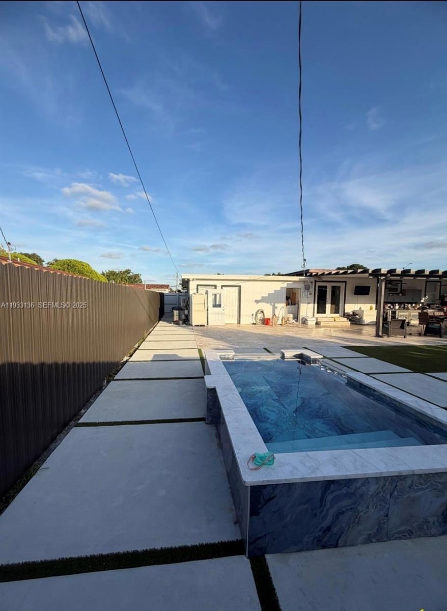 5168 East 8th Lane Hialeah, FL 33013 - Photo 15 of 19 a living room with a couch