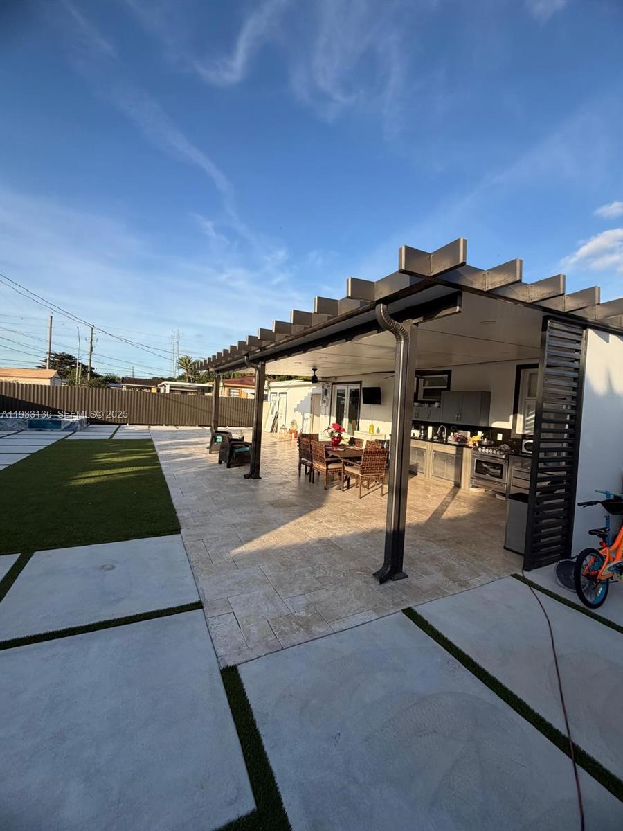 5168 East 8th Lane Hialeah, FL 33013 - Photo 17 of 19 a view of outdoor space with seating area