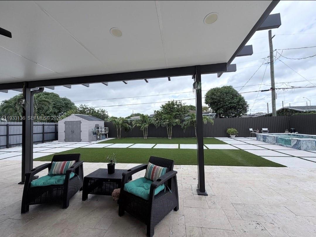 5168 East 8th Lane Hialeah, FL 33013 - Photo 18 of 19 a view of a couches in patio with a yard