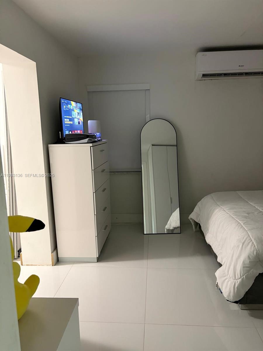 5168 East 8th Lane Hialeah, FL 33013 - Photo 5 of 19 a living room with furniture and a window