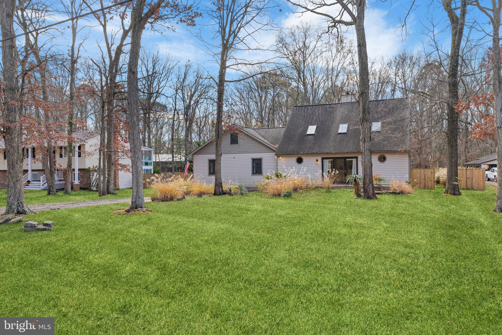 109 Woodmoor Road Stevensville, MD 21666 - Photo 1 of 31 a view of a house with a big yard and large trees