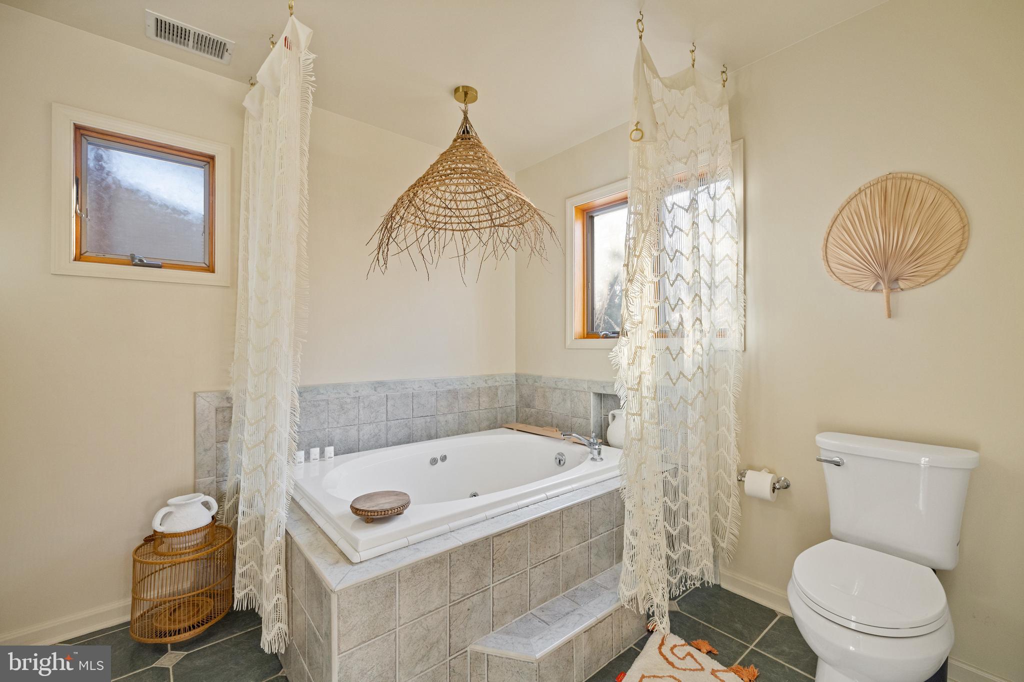 109 Woodmoor Road Stevensville, MD 21666 - Photo 21 of 31 a bathroom with a sink a toilet and a shower