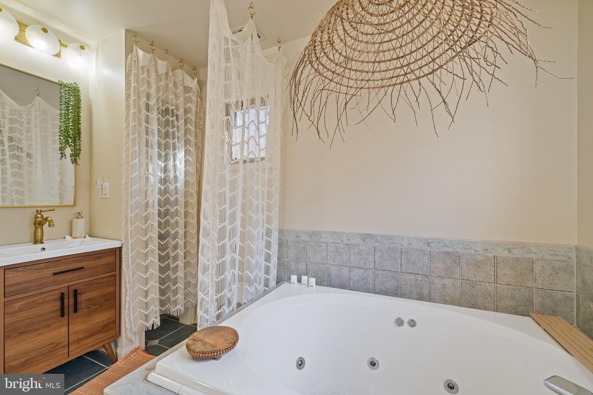 109 Woodmoor Road Stevensville, MD 21666 - Photo 22 of 31 a bathroom with a bathtub and shower