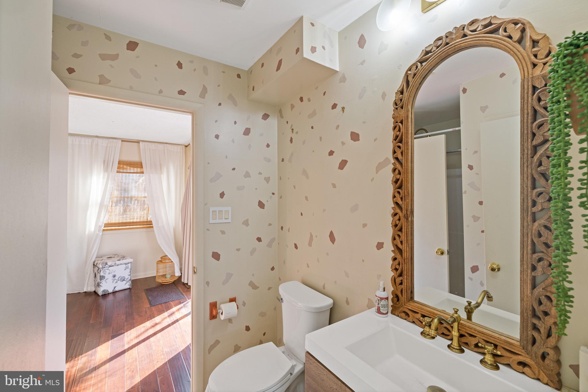109 Woodmoor Road Stevensville, MD 21666 - Photo 23 of 31 a bathroom with a sink a toilet and shower