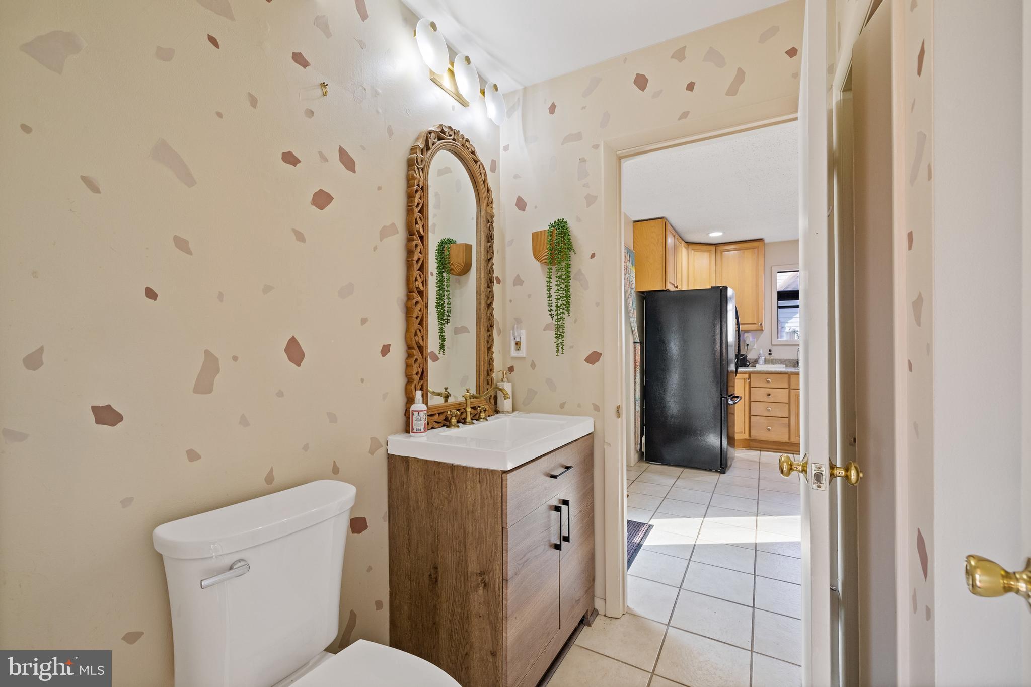 109 Woodmoor Road Stevensville, MD 21666 - Photo 24 of 31 a bathroom with a sink a toilet and shower