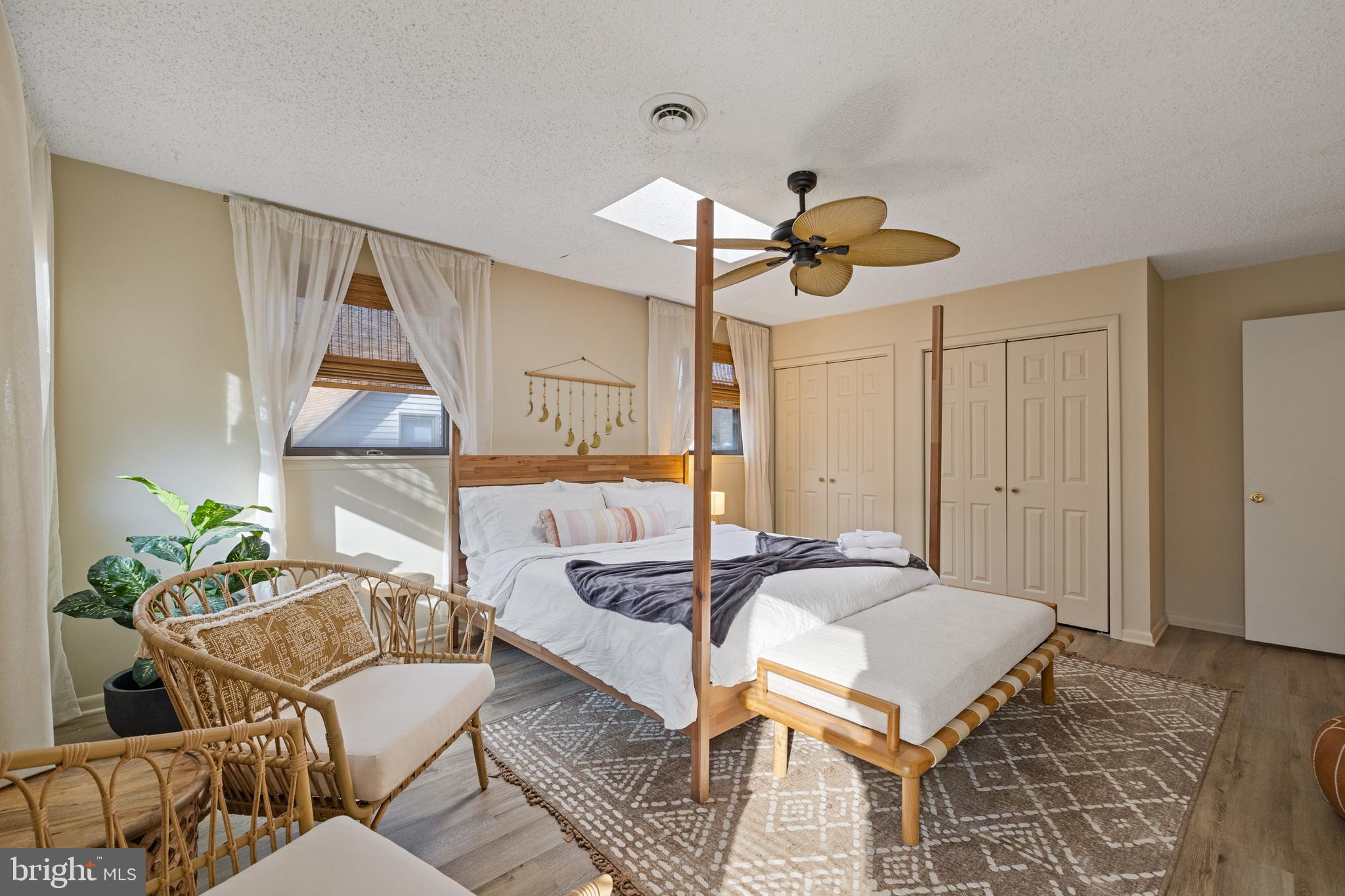 109 Woodmoor Road Stevensville, MD 21666 - Photo 29 of 31 a bedroom with furniture and a chandelier
