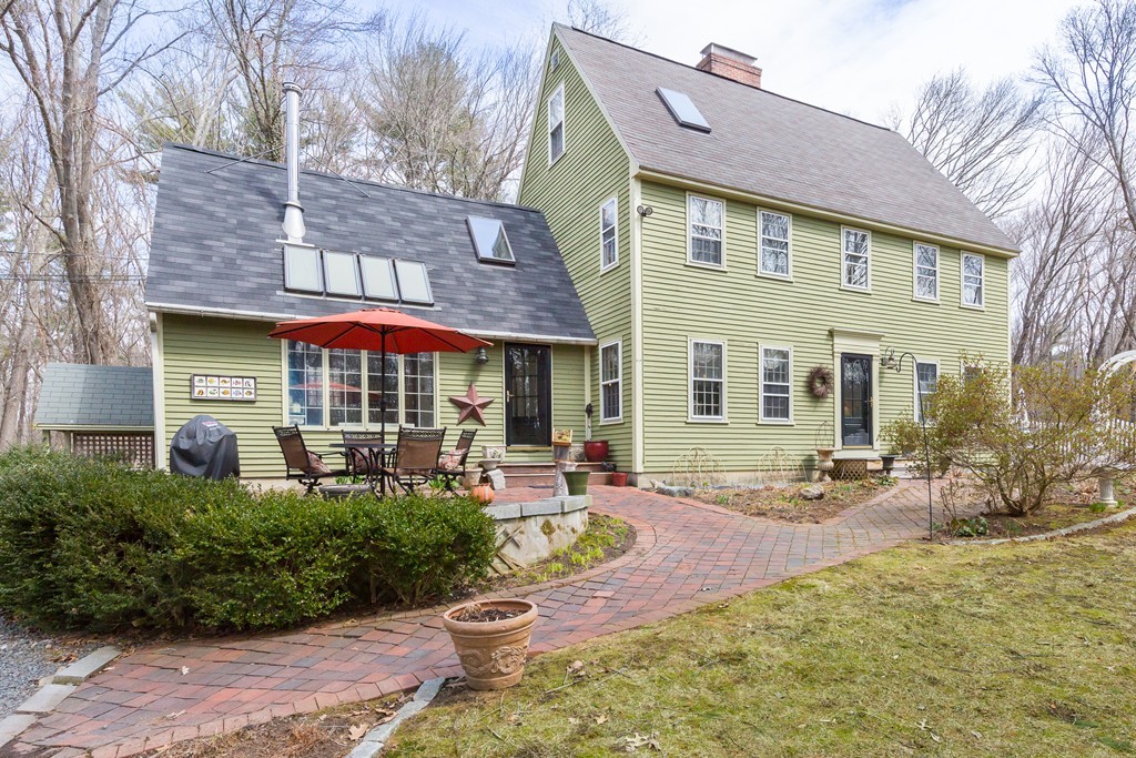 7 Buttonwood Road Amesbury, MA 01913 - Photo 1 of 29 a front view of a house with sitting area and garden