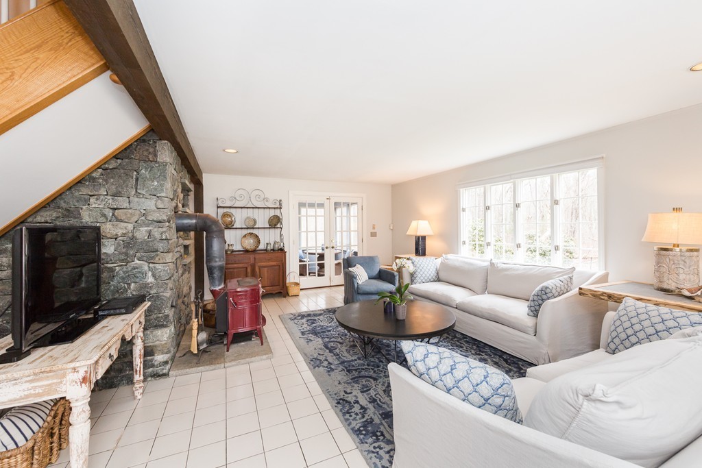 7 Buttonwood Road Amesbury, MA 01913 - Photo 11 of 29 a living room with furniture and a flat screen tv