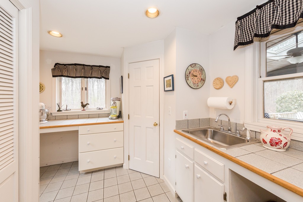 7 Buttonwood Road Amesbury, MA 01913 - Photo 24 of 29 a bathroom with a sink and a mirror