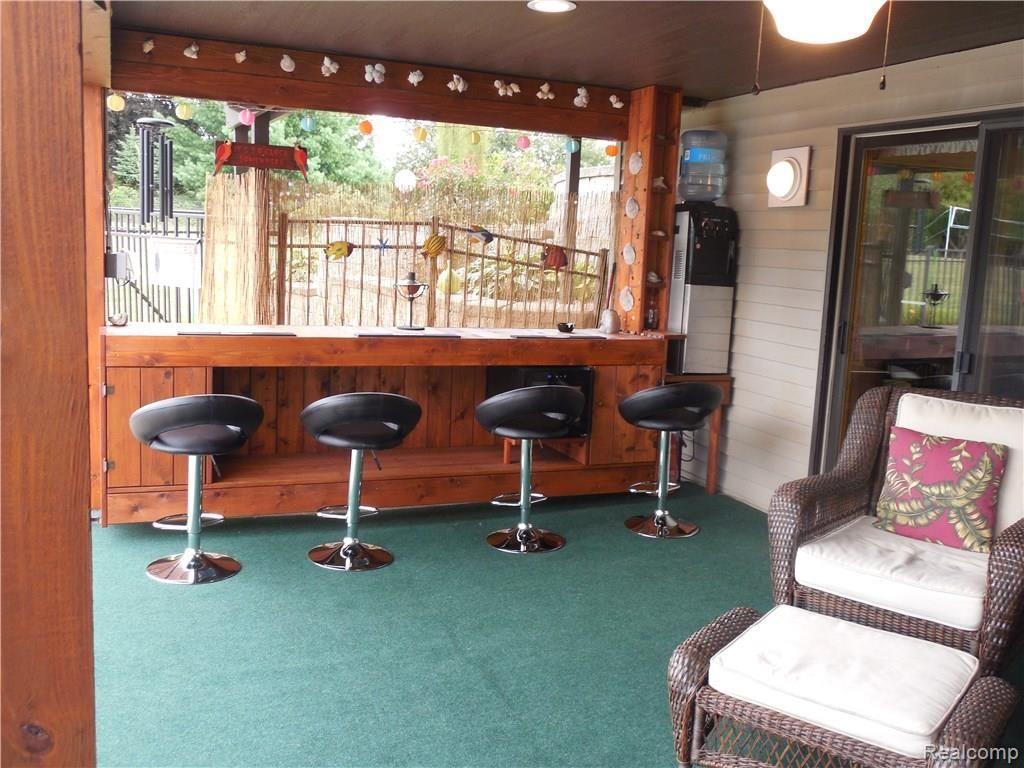 3955 Innisfree Road Howell, MI 48855 - Photo 18 of 43 Bar area for lots of entertaining.