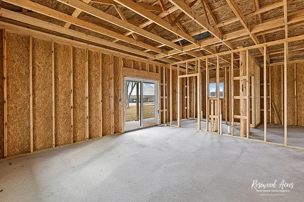 a view of an empty room with windows