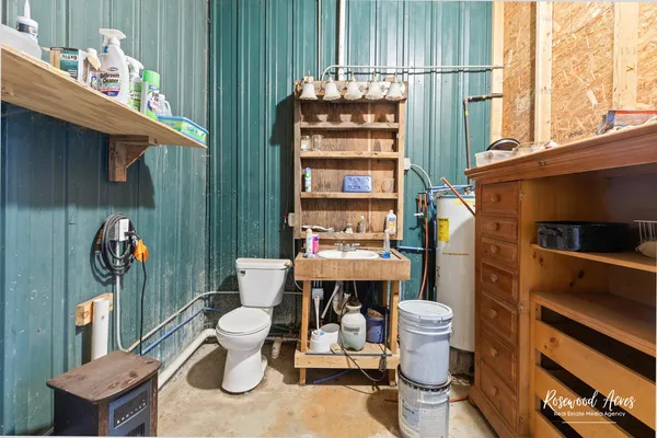 a bathroom with a toilet and a sink