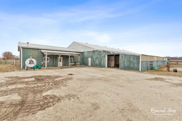 a view of a house with a yard and garage