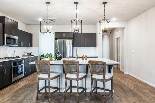 a view of kitchen and dining area with furniture