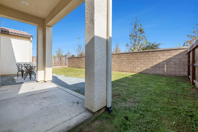 a view of a backyard of the house