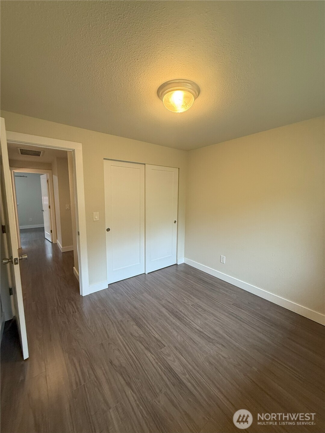 8820 Prentice Avenue Gig Harbor, WA 98332 - Photo 12 of 13 wooden floor in an empty room