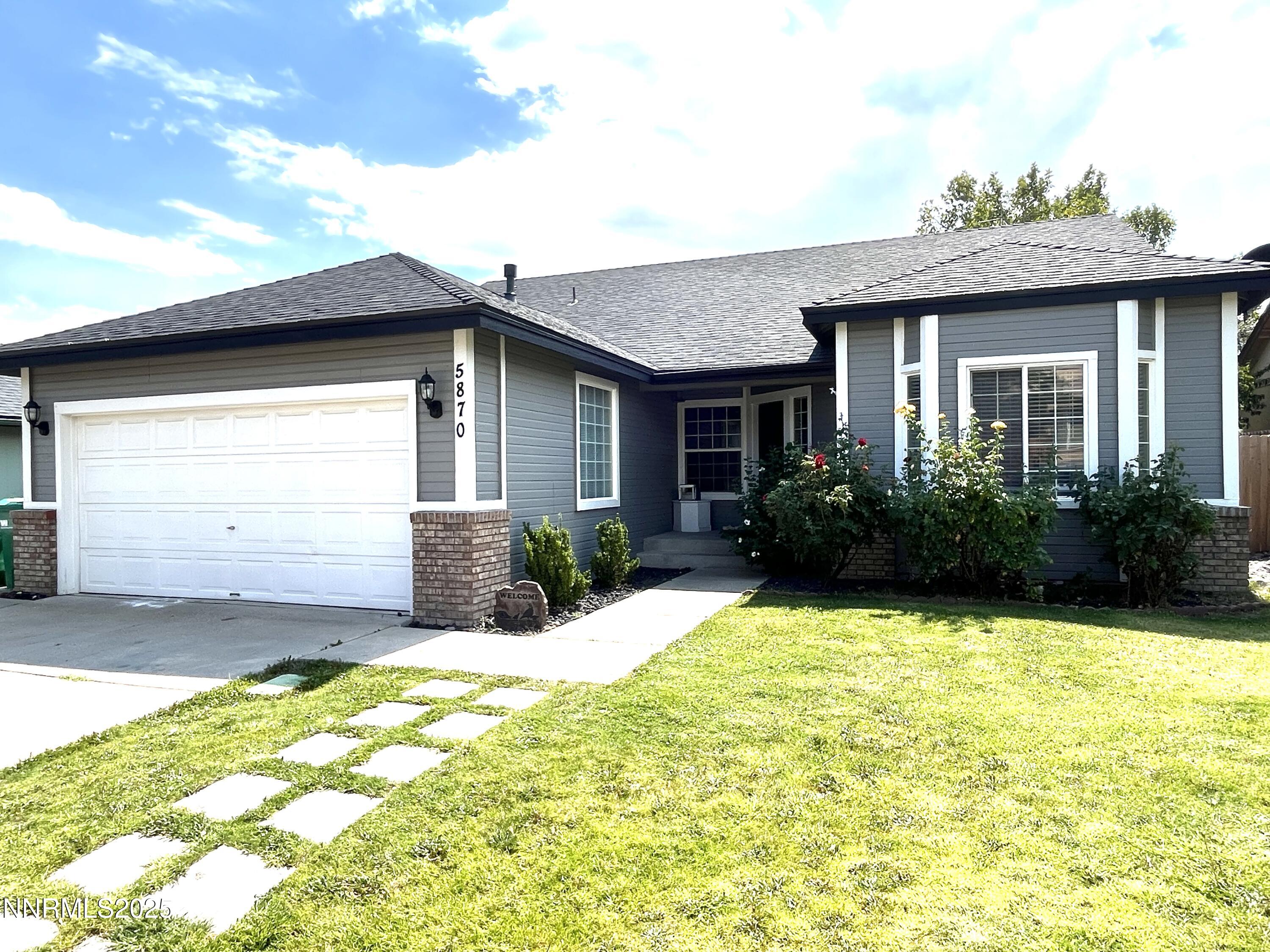 a view of a house with pool and garden