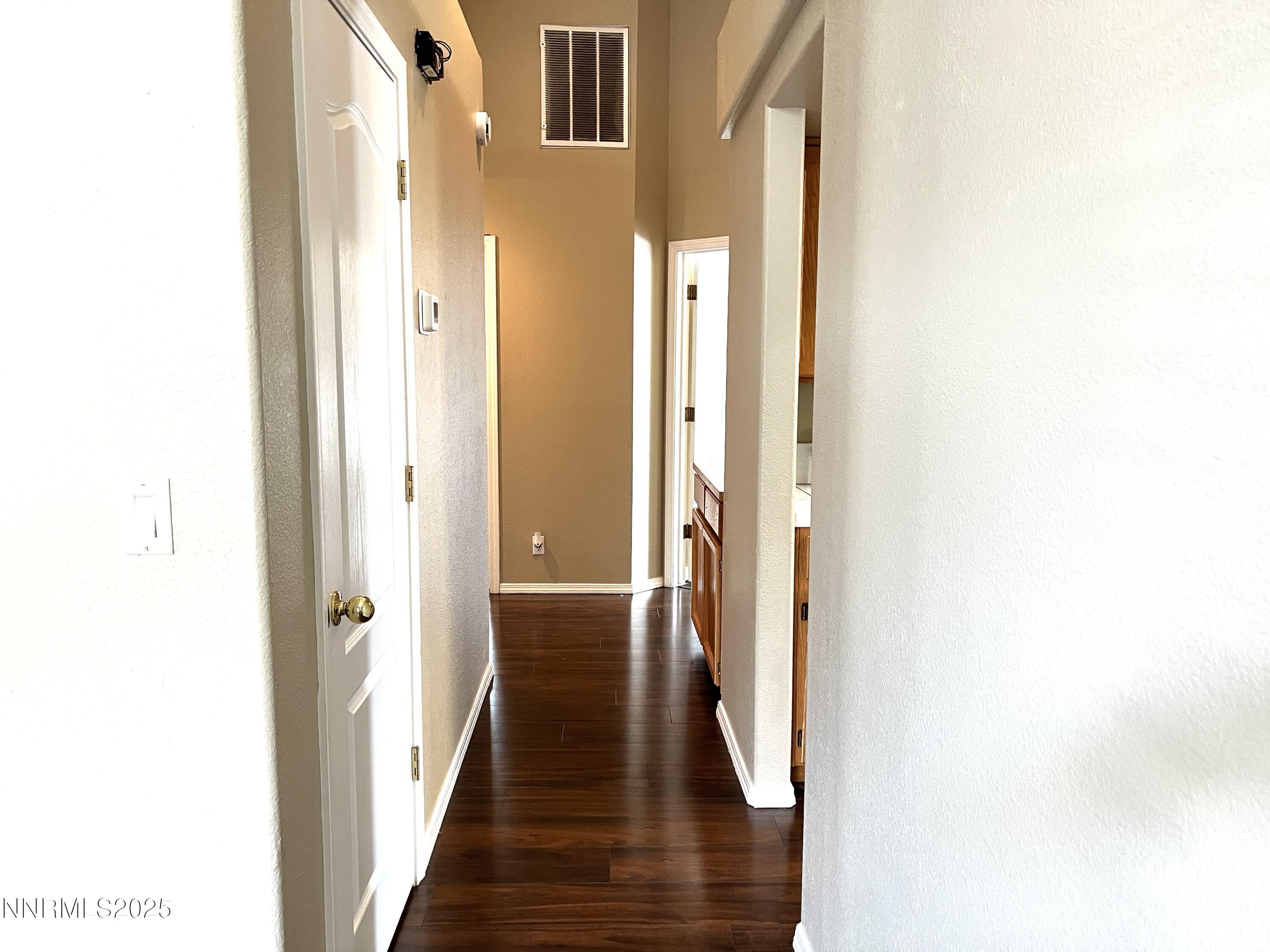 5870 Blue Horizon Drive Reno, NV 89523 - Photo 11 of 21 a view of a hallway with the wooden floor
