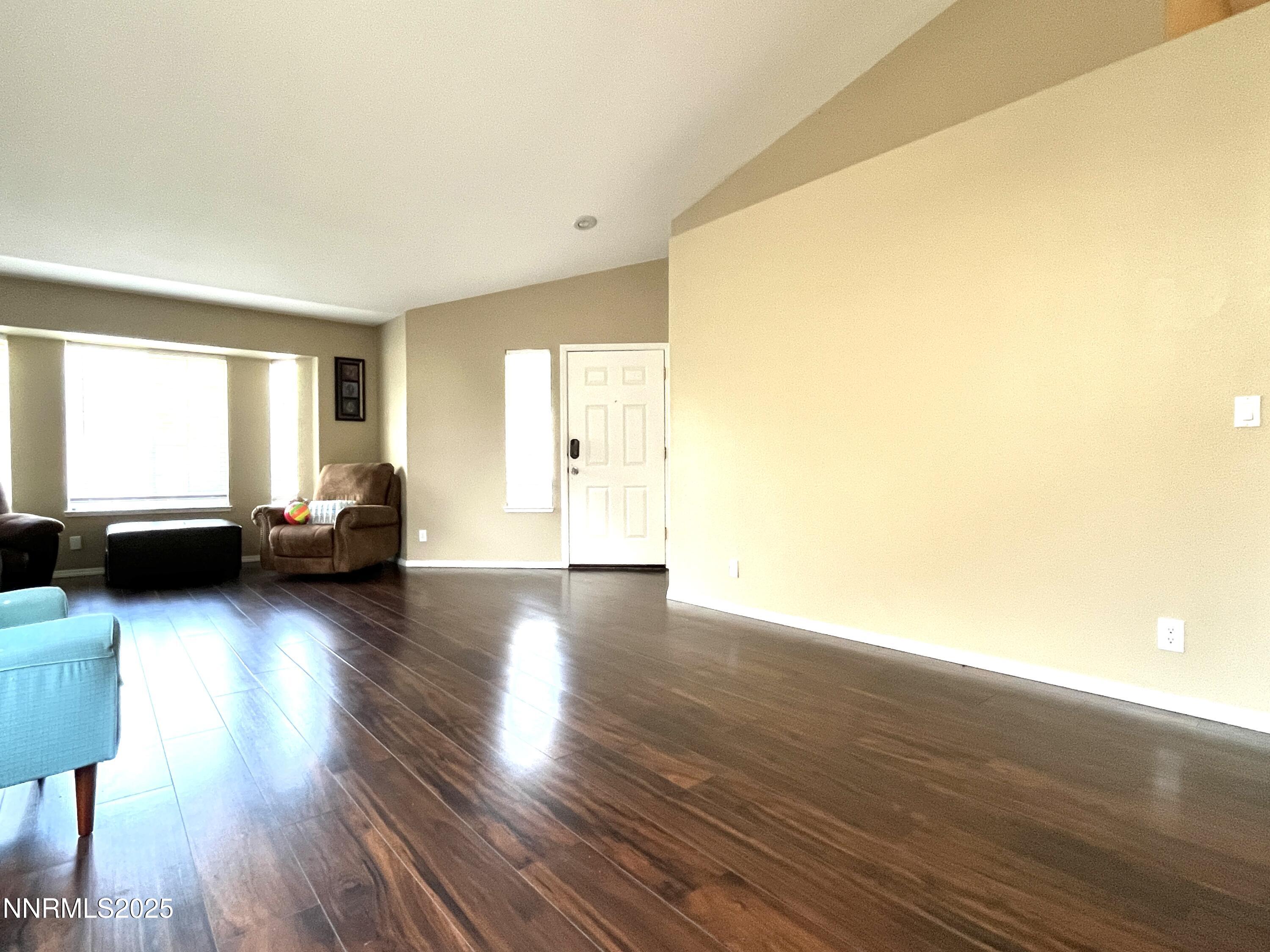 5870 Blue Horizon Drive Reno, NV 89523 - Photo 6 of 21 a view of a livingroom with wooden floor and furniture