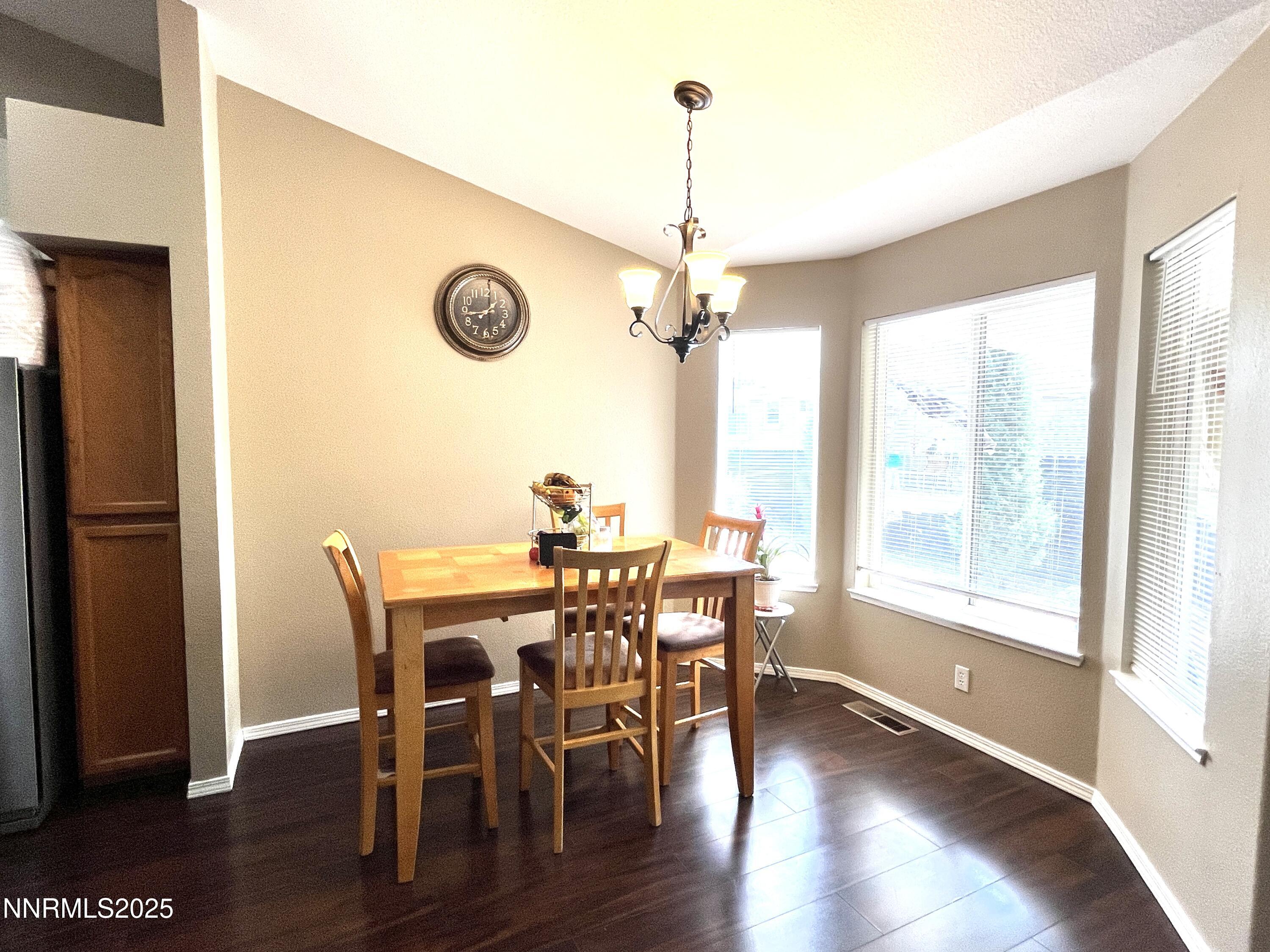 5870 Blue Horizon Drive Reno, NV 89523 - Photo 7 of 21 a view of a dining room with furniture window and wooden floor