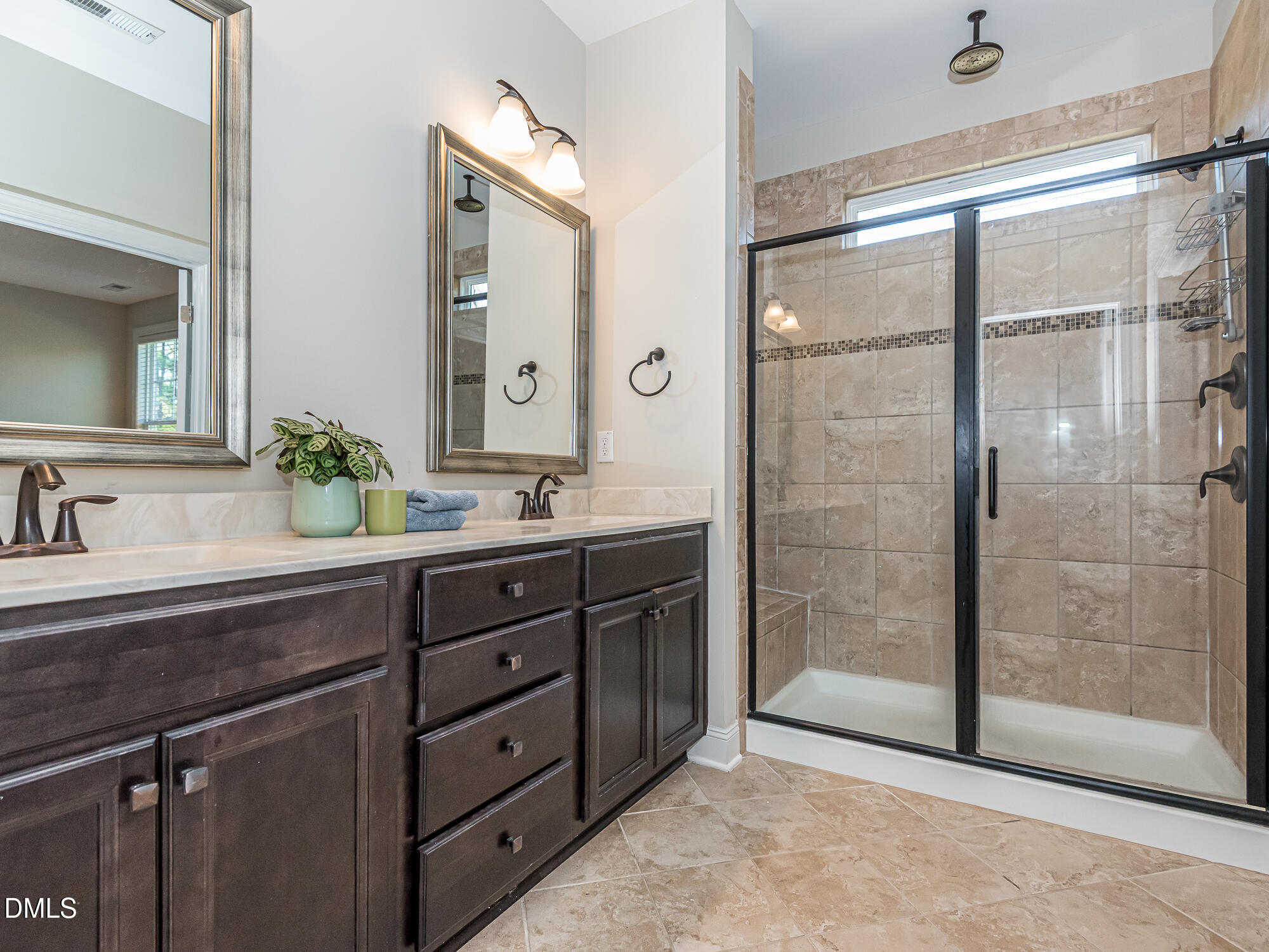 904 Dalton Ridge Place Apex, NC 27523 - Photo 13 of 36 a bathroom with a shower sink and mirror