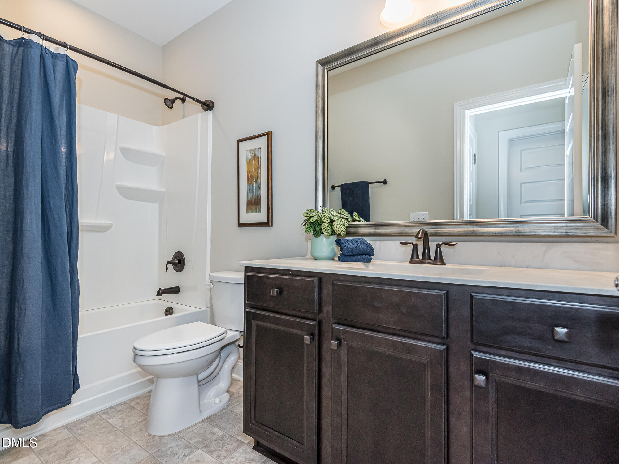 904 Dalton Ridge Place Apex, NC 27523 - Photo 18 of 36 a bathroom with a sink a toilet and shower