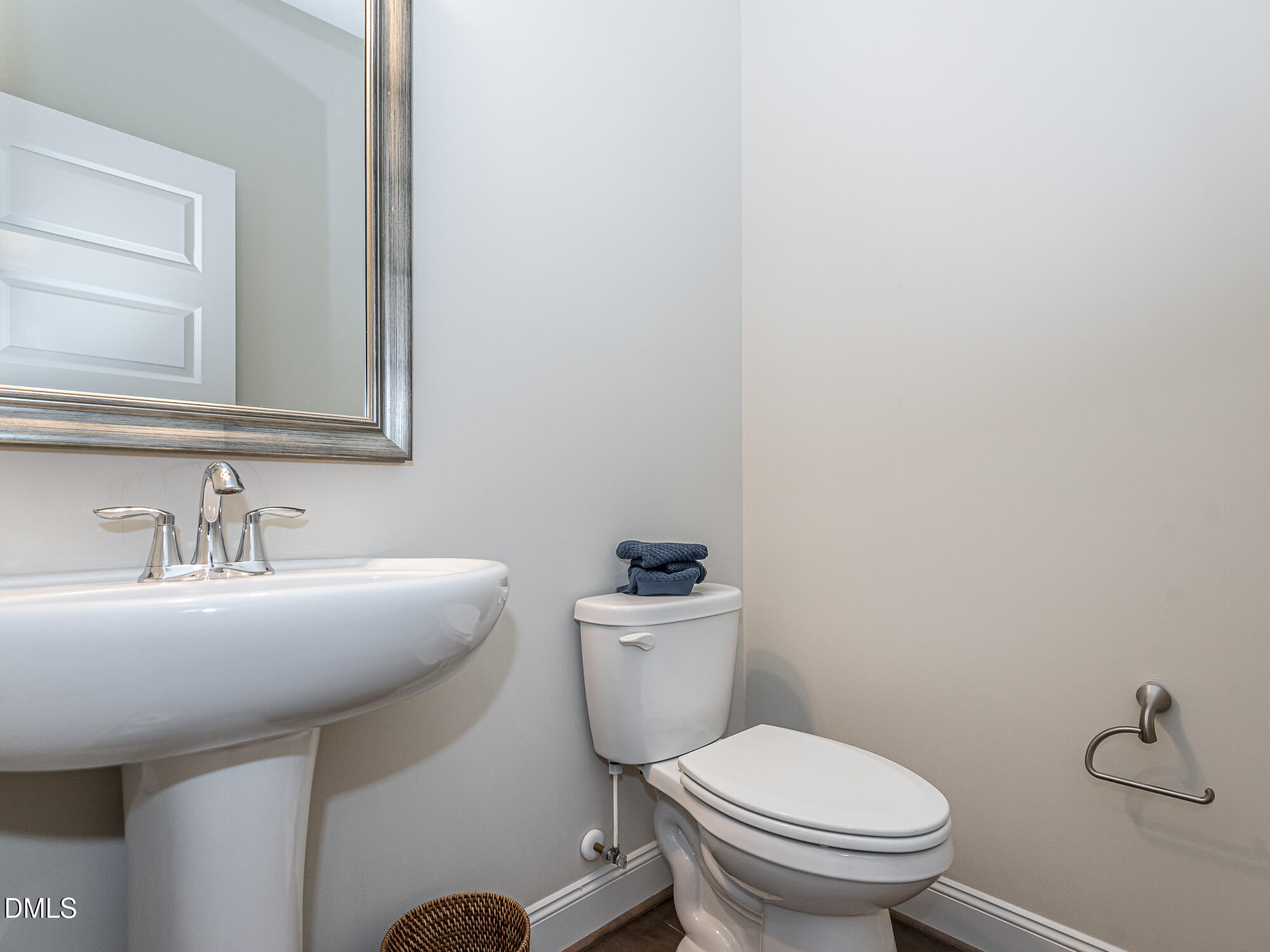 904 Dalton Ridge Place Apex, NC 27523 - Photo 23 of 36 a bathroom with a sink mirror and toilet