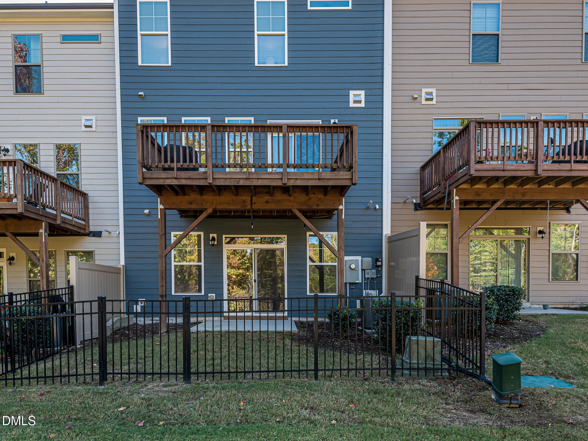 904 Dalton Ridge Place Apex, NC 27523 - Photo 29 of 36 a view of a brick house with many windows and plants