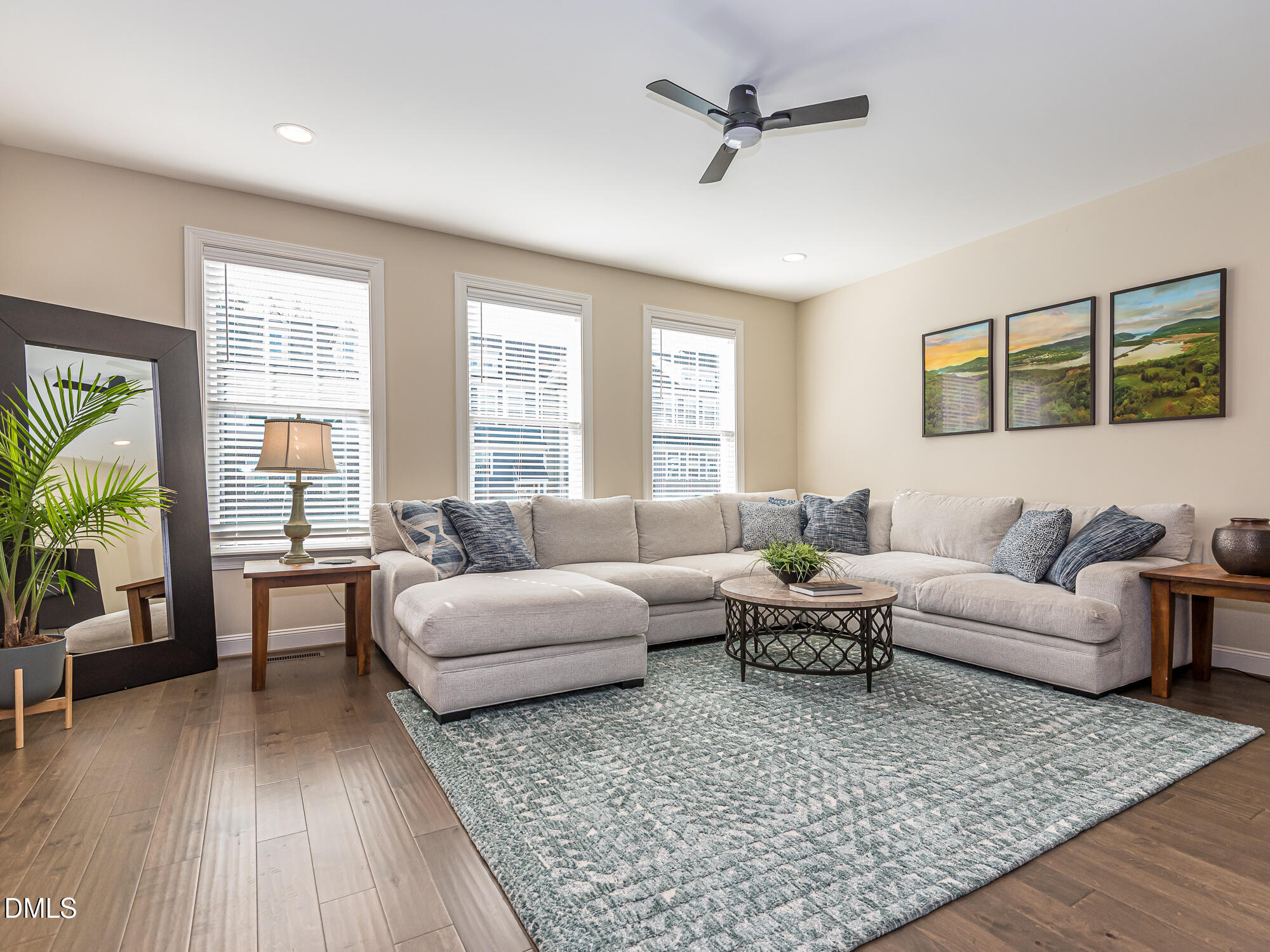 904 Dalton Ridge Place Apex, NC 27523 - Photo 6 of 36 a living room with furniture and a large window