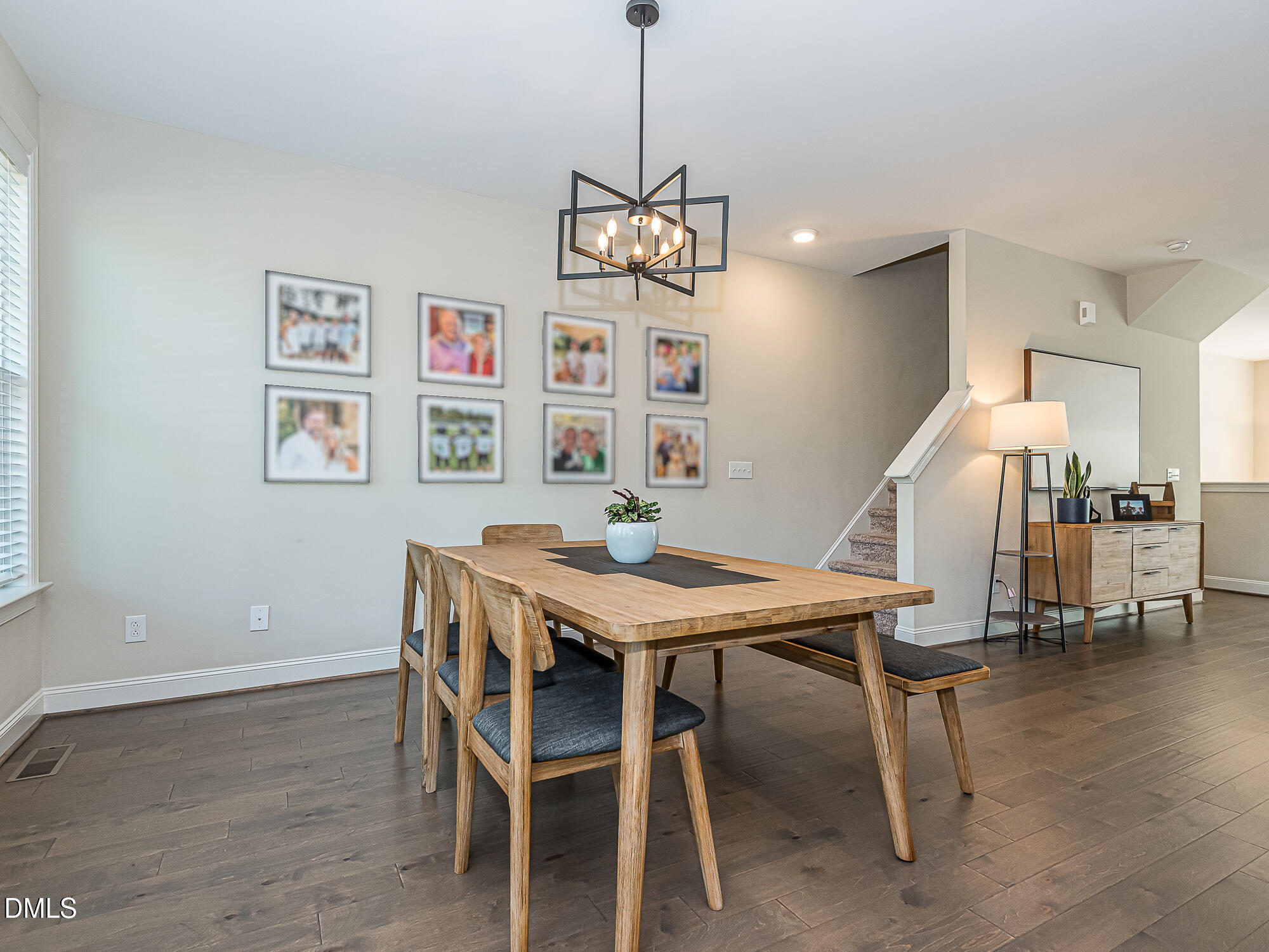904 Dalton Ridge Place Apex, NC 27523 - Photo 9 of 36 a view of a dining room with furniture and wooden floor