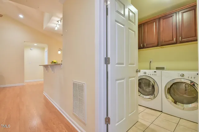 a view of a kitchen with stainless steel appliances granite countertop a refrigerator and a sink