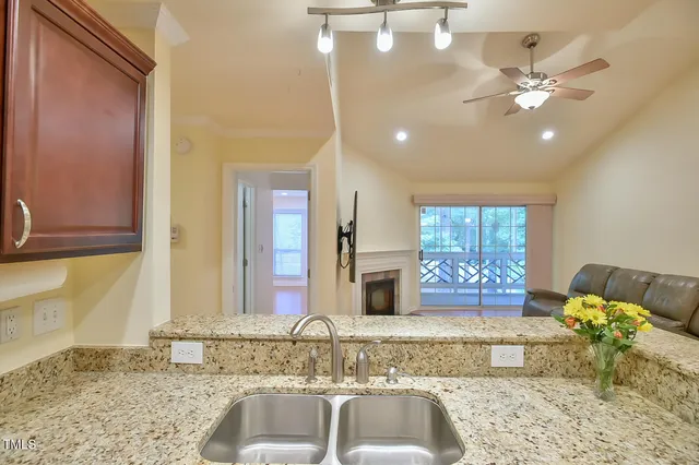 a view of a livingroom with furniture and chandelier